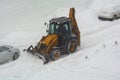 Clearing the road from snow. February snowfall Royalty Free Stock Photo