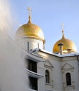 Clearing roofs from snow. Assumption church.