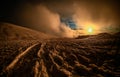 Sunset on volcano Etna with snowy wintry mountainscape and cloudy sky