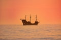 Captain Memo`s Pirate Cruise on colorful sunset background in Gulf Coast Beaches.