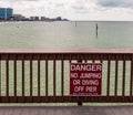 Clearwater Beach, Florida, USA 11/6/19 A danger sign warning people on Pier 60 not to dive of jump into the water Royalty Free Stock Photo