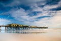 Daytona Beach in Florida Sunglow Pier before storm with water reflection