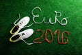 Cleats and Euro 2016 sign against artificial turf