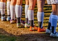 Cleats, Socks and Legs in the mud Royalty Free Stock Photo