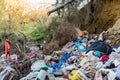 Cleen little creek contaminated with household waste, conceptual human negligence image. Royalty Free Stock Photo