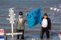 Protestors with signs on Cleethorpes beach