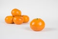 Clementine Separated from Small Pile Isolated on White Royalty Free Stock Photo