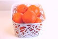 Clementines in a white basket Royalty Free Stock Photo