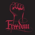 Clenched fist held high in protest with handwritten word freedom. Lettering inscription Freedom.