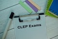 CLEP Exams write on a paperwork isolated on office desk Royalty Free Stock Photo
