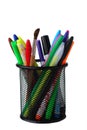 Clerical glass with pens and felt-tip pens on a white background