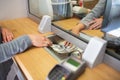 Clerk giving cash money to customer at bank office Royalty Free Stock Photo