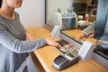 Clerk giving cash money to customer at bank office Royalty Free Stock Photo