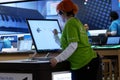 Clerk painting on new computer at Microsoft store