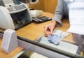 Clerk with swiss francs cash money at bank office Royalty Free Stock Photo