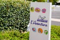 Michelin l`aventure bibendum logo sign and text front of entrance corporate
