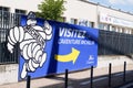 Michelin l`aventure bibendum logo sign and text front of entrance corporate