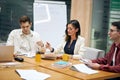 Clever attractive brunette woman telling her colleagues about new opportunities Royalty Free Stock Photo