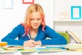 Clever beautiful teen girl do homework at homw Royalty Free Stock Photo