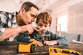 Clever father and son fascinated by the scale of things. Royalty Free Stock Photo