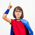 Clever super hero child raising her finger for surprising idea