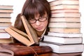 Clever girl with heap book. Royalty Free Stock Photo