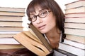Clever girl with heap book. Royalty Free Stock Photo