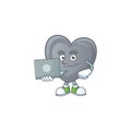 A clever grey love mascot character working with laptop