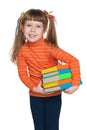Clever little girl with books