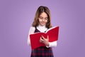 Clever little schoolgirl reading book Royalty Free Stock Photo