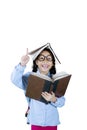 Clever schoolgirl getting inspiration on studio Royalty Free Stock Photo