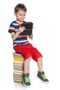 Clever young boy with a gadget Royalty Free Stock Photo