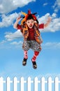 Clhild clown Jumping Fence Royalty Free Stock Photo