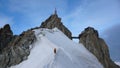 Clibers descending the Aiguille du Midi in France Royalty Free Stock Photo