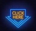 Click here neon sign on brick wall background. Royalty Free Stock Photo