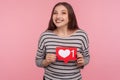 Click Like and follow my blog! Portrait of happy blogger woman in striped sweatshirt holding social media Heart button