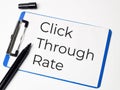 Click through rate concept written on paper clipboard. Royalty Free Stock Photo