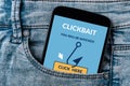 Clickbait concept on smartphone screen in jeans pocket