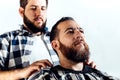 Client of a barber shop getting hairdressing Royalty Free Stock Photo