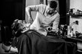 Client during beard shaving at barbershop. Royalty Free Stock Photo