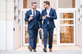 Client at business meeting. Two businessmen discussing outdoor. Two business people talk project strategy. Two american Royalty Free Stock Photo