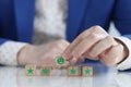 Client is holding smiling smiley face on wooden cube Royalty Free Stock Photo