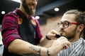 Client during beard shaving in barber shop Royalty Free Stock Photo