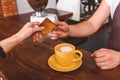 Client paying for beverage in coffeehouse Royalty Free Stock Photo