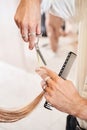 Client receiving a haircut at the local beauty salon Royalty Free Stock Photo
