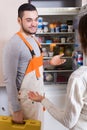 Client and repairman near fridge Royalty Free Stock Photo