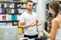 Client at shop paying at cash register desk Royalty Free Stock Photo