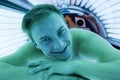 Client in a solarium on tanning bed Royalty Free Stock Photo