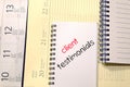 Client testimonials text concept on notebook Royalty Free Stock Photo