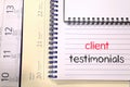Client testimonials text concept on notebook Royalty Free Stock Photo